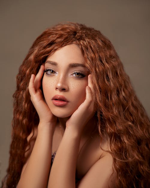 Young Woman with Wavy Red Hair and Freckles