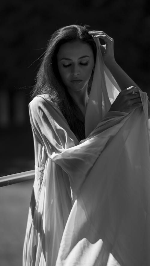 Brunette Woman Wearing Tulle Dress in Black and White 