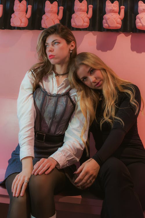 Women Posing in Pink Studio 
