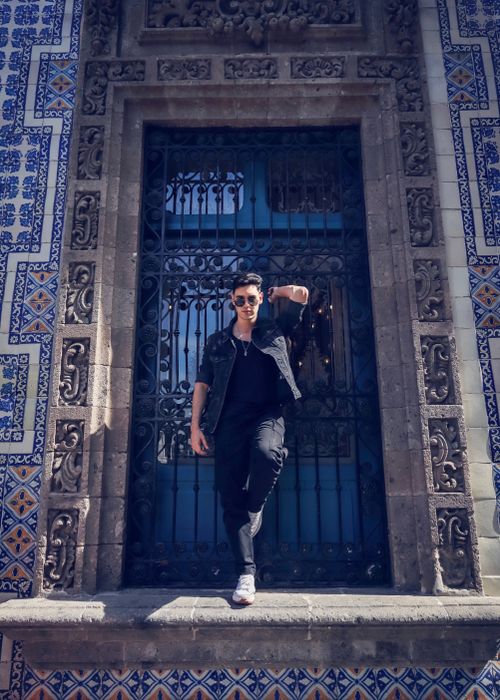 Free Fashionable man in black outfit posing confidently at the House of Tiles, Mexico City. Stock Photo