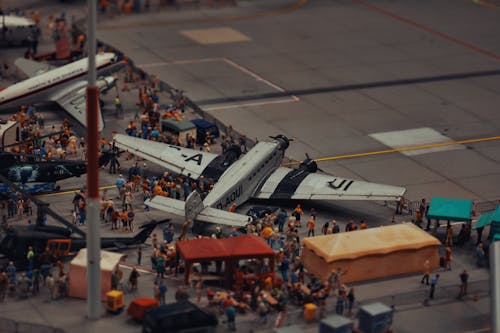 Free Toy Airplane and People Dolls around Stock Photo