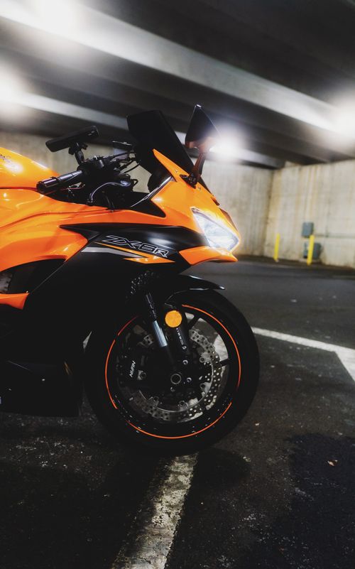 Free Vibrant yellow sports motorcycle parked in an indoor garage in Atlanta, GA. Stock Photo
