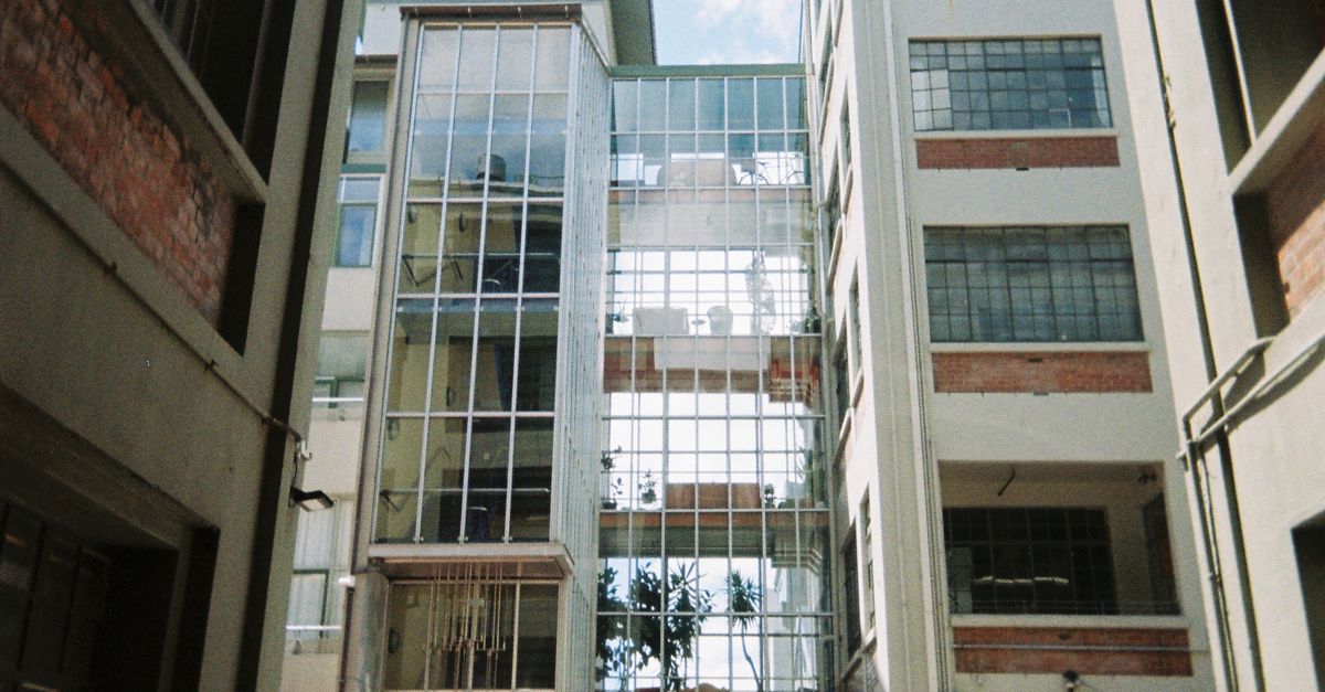 Modern urban architecture showcasing glass facades in Wellington, New Zealand.