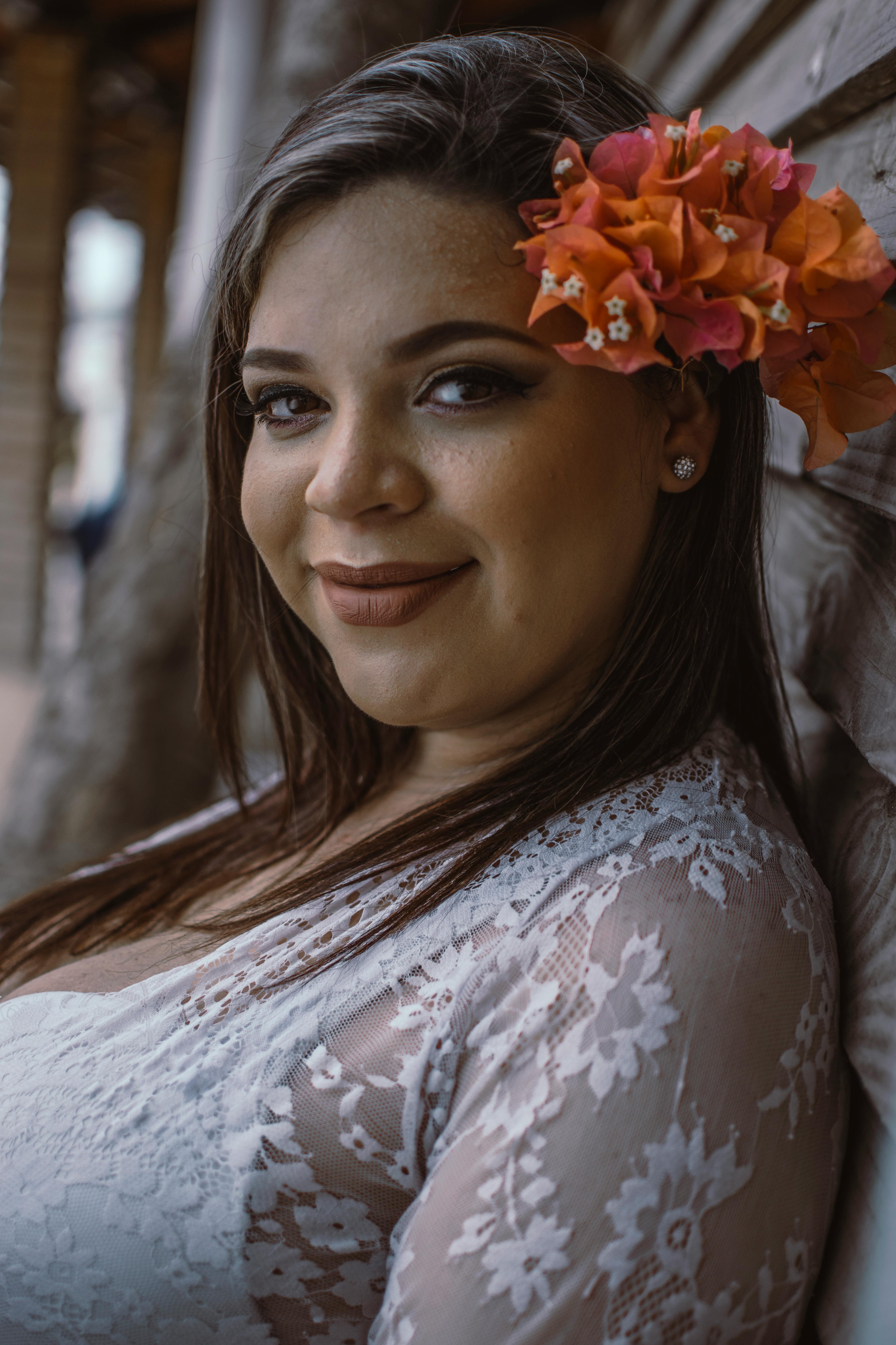Free Woman Leaning on Gray Wooden Wall Stock Photo