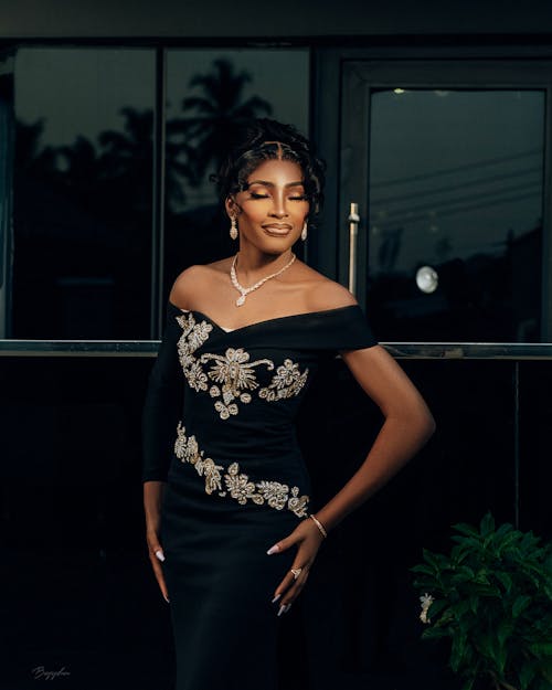 Young Woman Posing in a Black Dress 