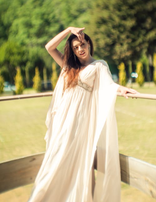 Portrait of Woman in White Dress