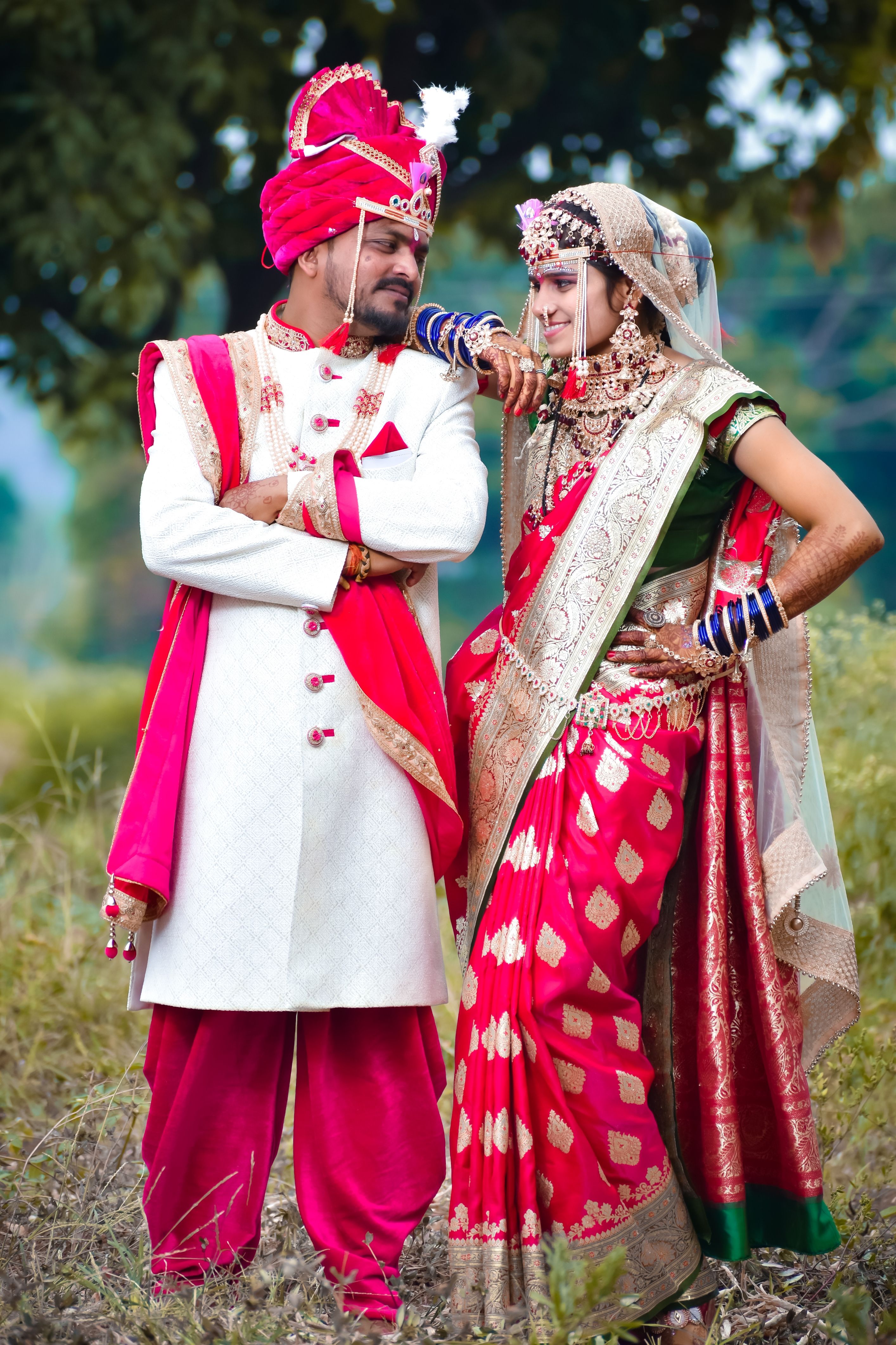 Smiling Couple in Traditional Clothing · Free Stock Photo