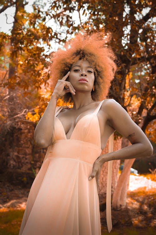 Model Posing in Peach Dress