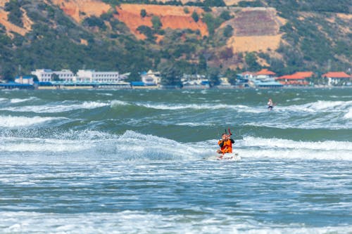 Man Surfing on Waves