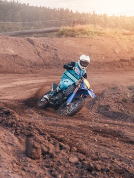 Motocross rider skillfully navigating a dirt track, capturing speed and motion.