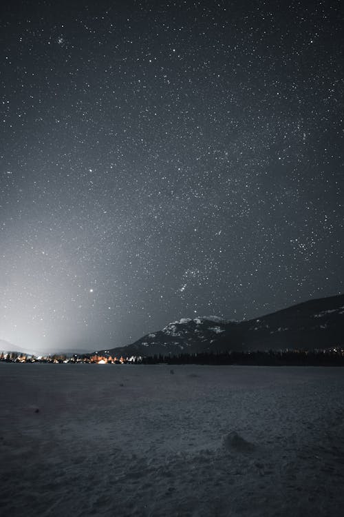 Mountain Near City during Nighttime