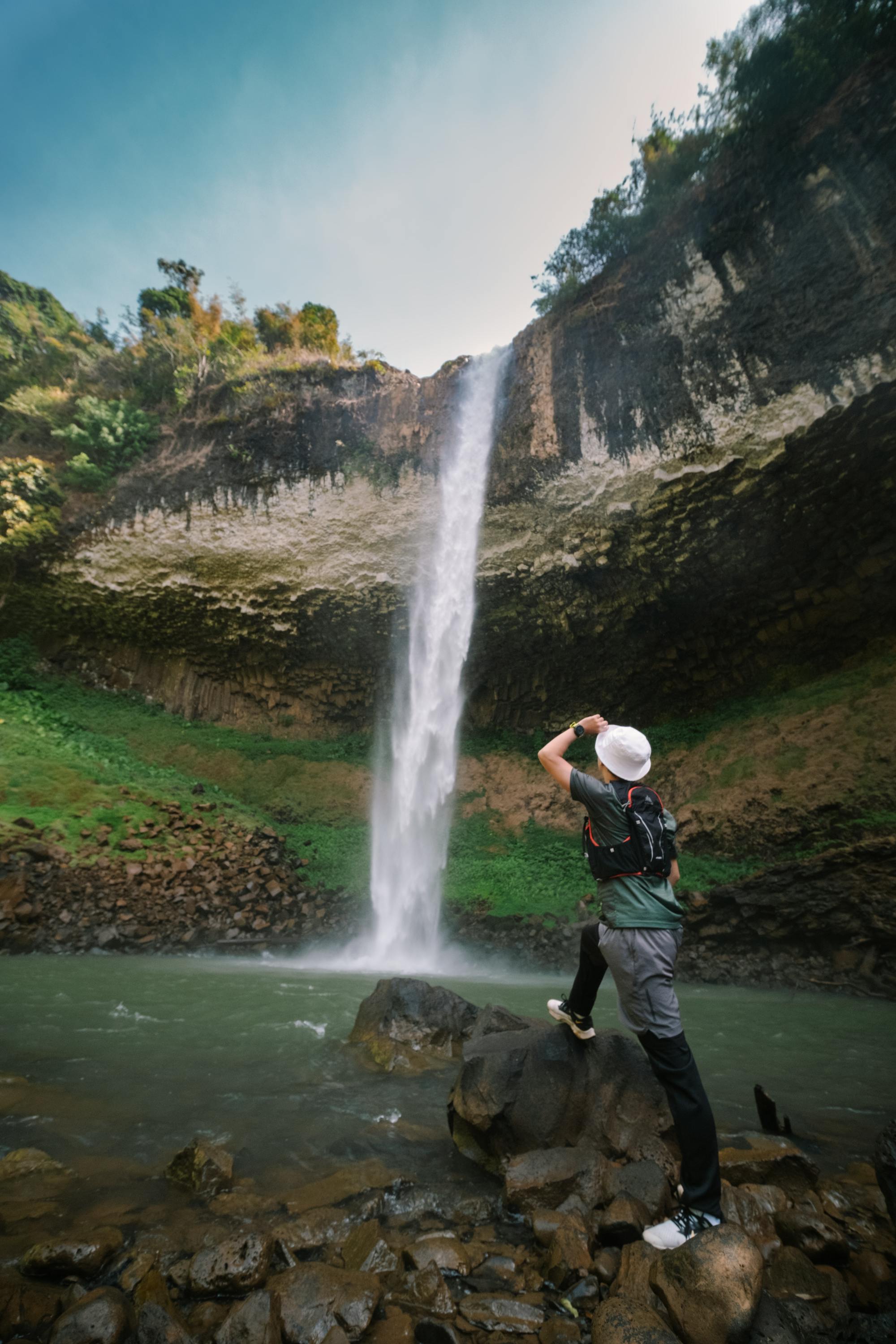 traveler photographing lien nung waterfall