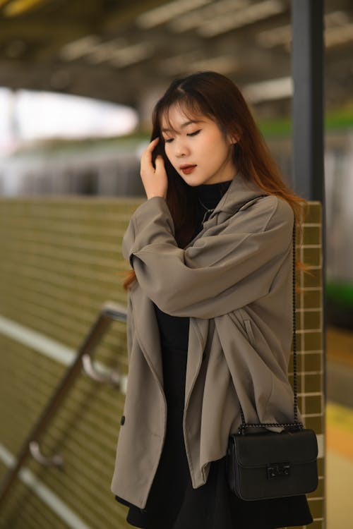 Portrait of Woman in Coat and with Bag