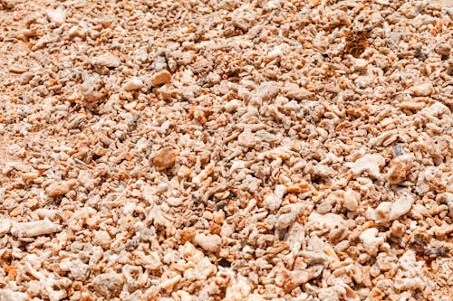 A pile of gravel and sand on the ground