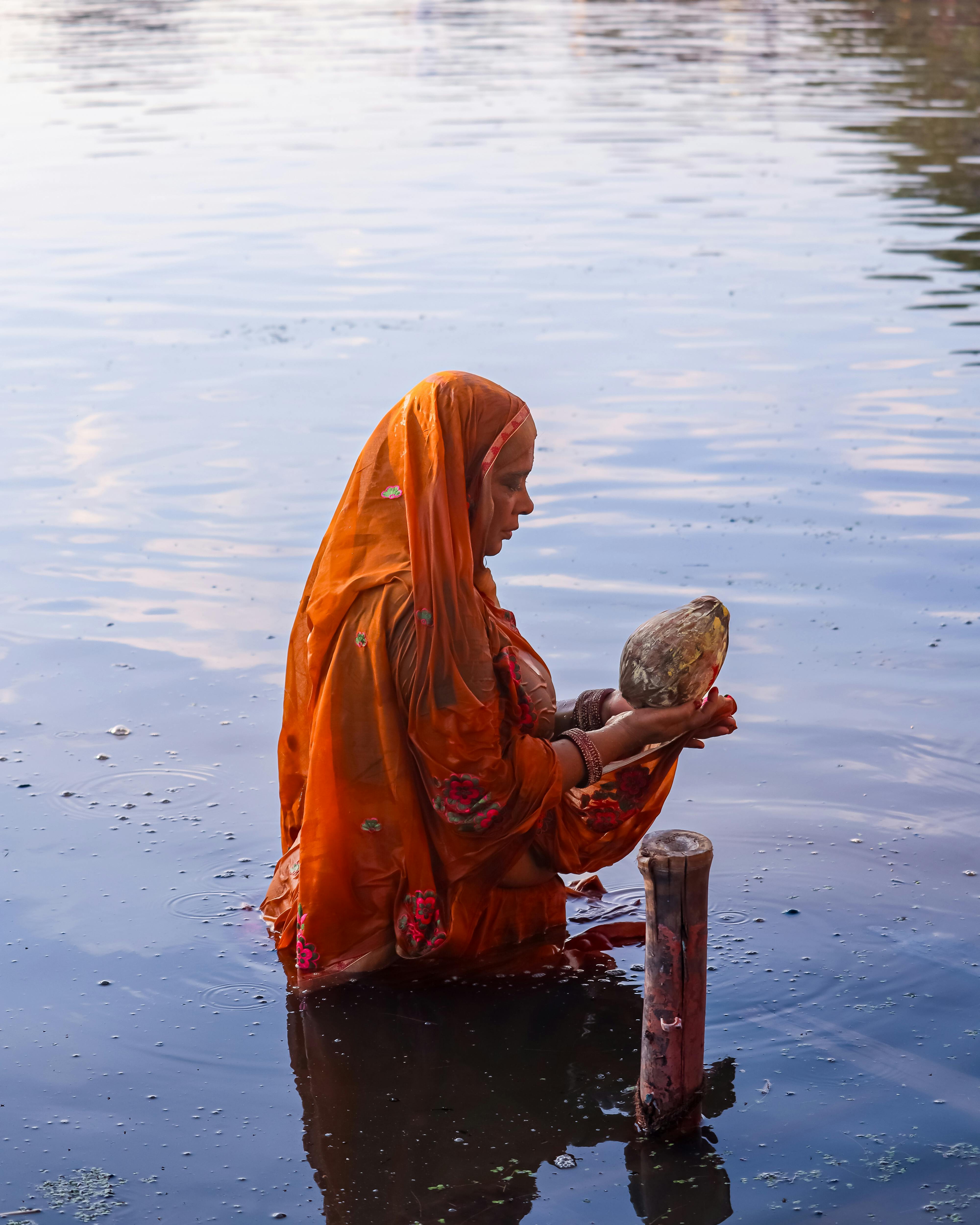 Woman in Traditional Clothing in Ritual in Lake · Free Stock Photo