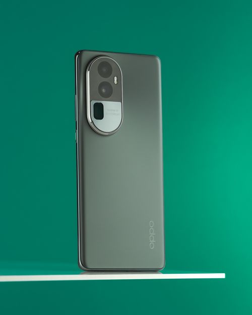 Free Elegant smartphone with dual camera against a vibrant green background, showcasing modern technology. Stock Photo