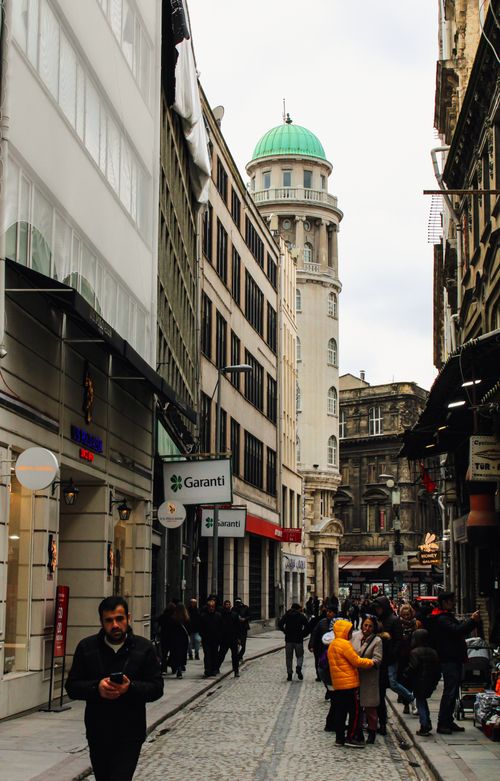 Free A bustling Istanbul street with historic architecture and people walking on cobblestone. Stock Photo