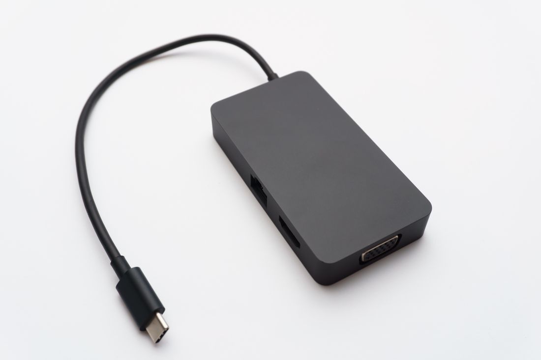 USB-C hub with HDMI and USB ports on a white background
