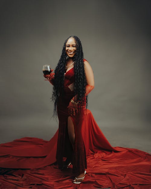 Smiling Woman in Red Dress and with Wine