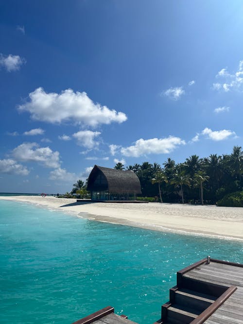  Beachfront House in Maldives under a Blue Sky 