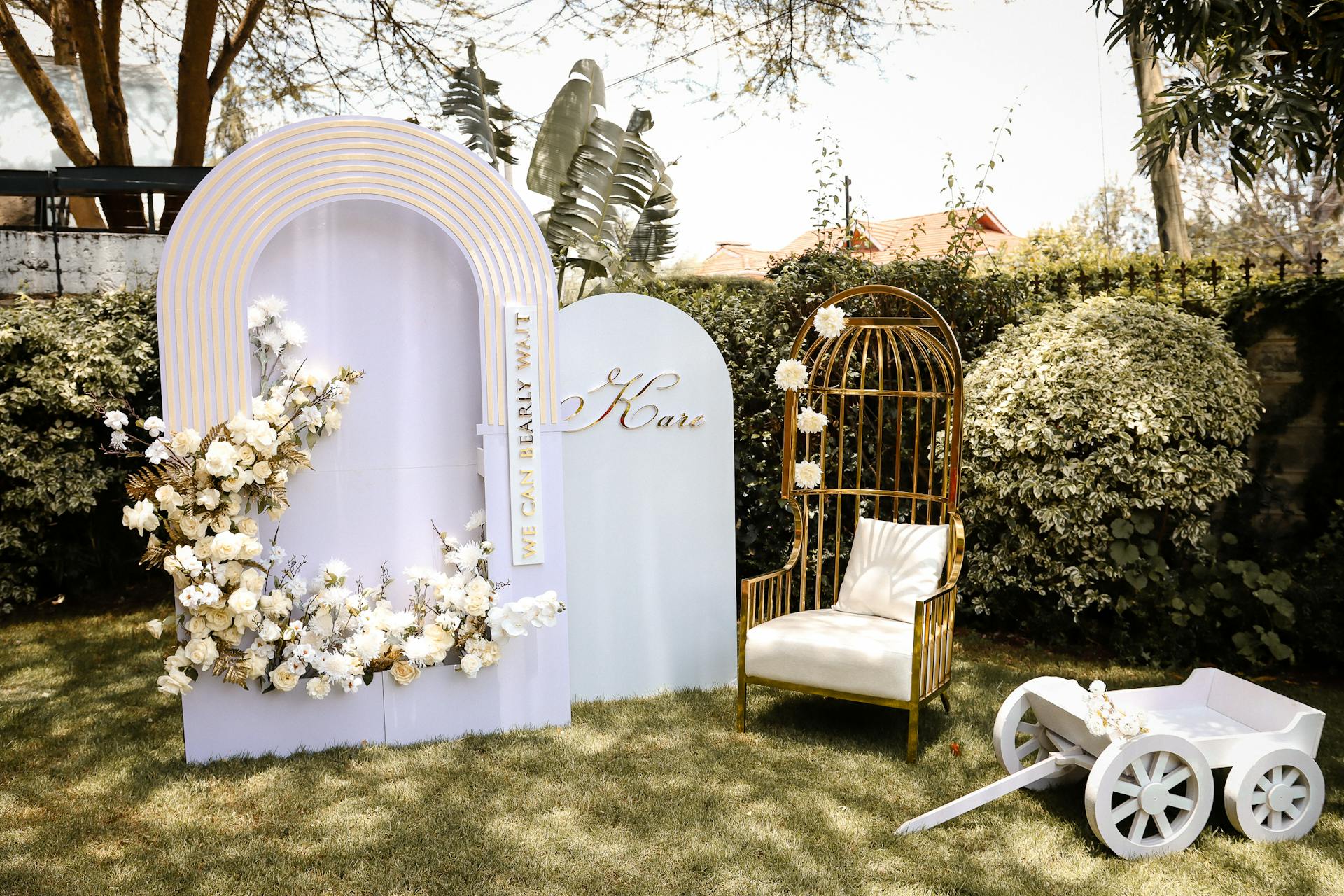 Chic baby shower decoration outdoors with floral arrangement and elegant seating.