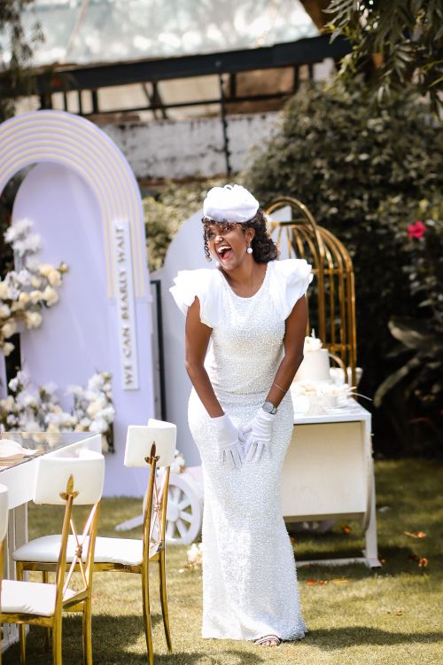 Woman in a White Dress Standing near a Table at a Garden Party  Free Stock  Photo