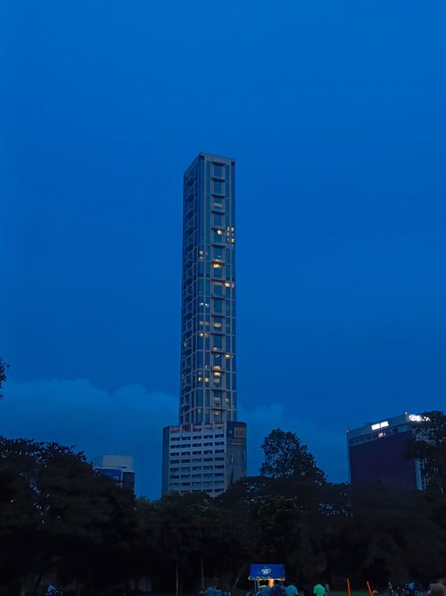 Free Elegant view of The 42 skyscraper amidst Kolkata's urban skyline at dusk. Stock Photo