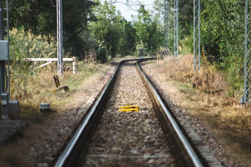 Free Beautiful railway tracks surrounded by nature in Reggio Emilia, Italy. Stock Photo