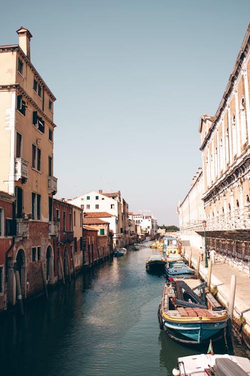 Boats Along Canal in Venice, Italy