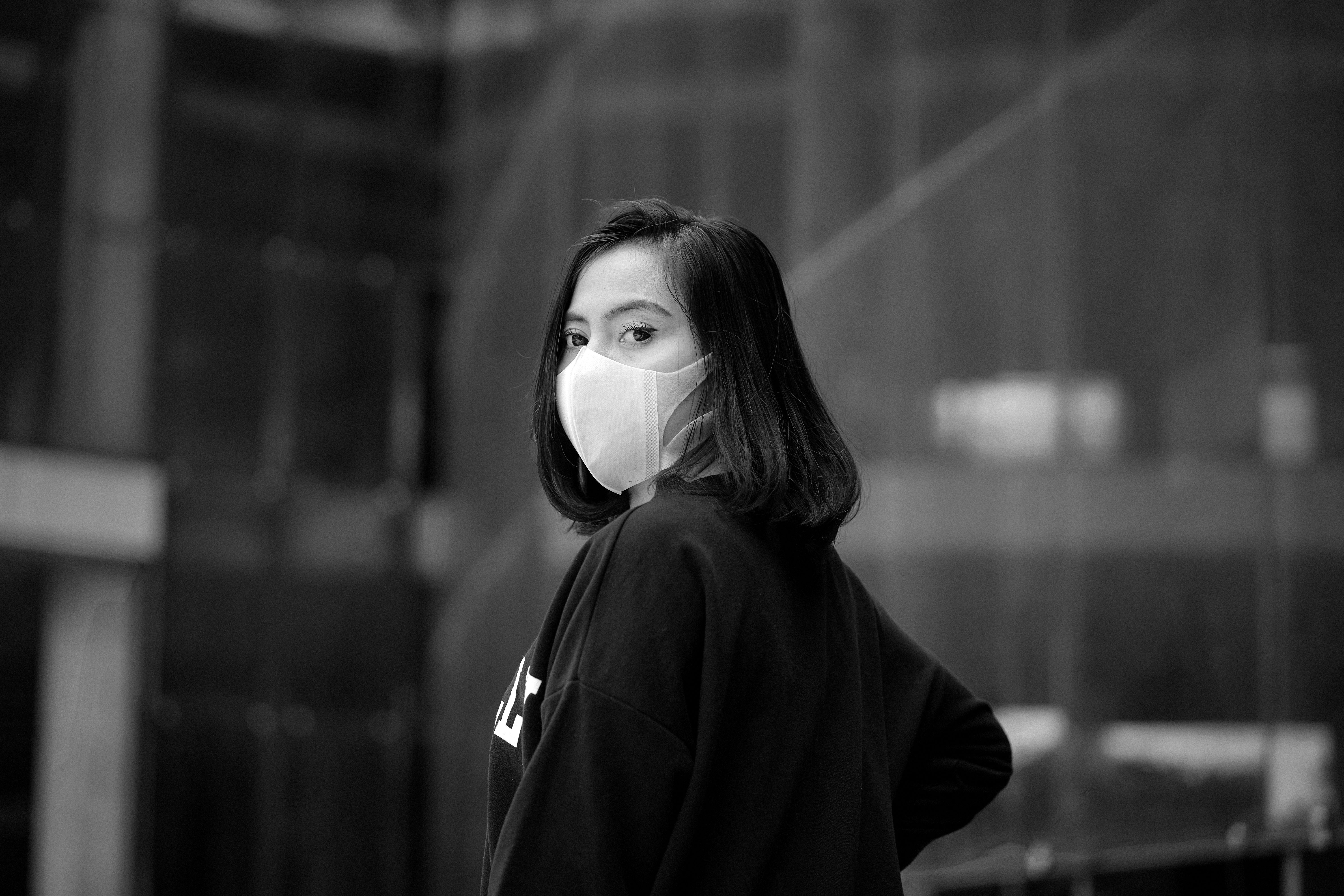 Black and White Photo of a Young Woman Wearing a Face Mask · Free Stock ...