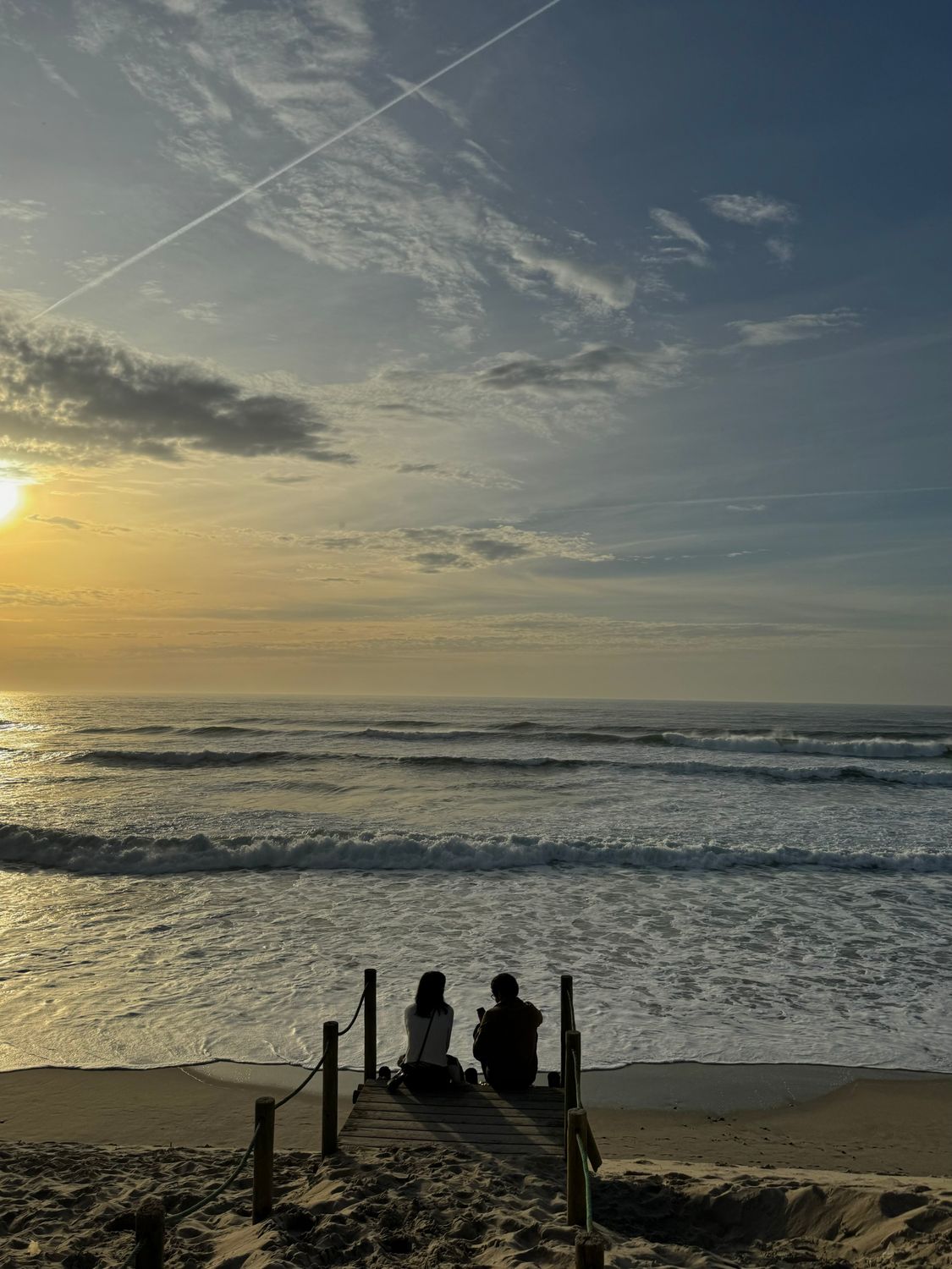 Couple Sitting on Beach at Sunset · Free Stock Photo