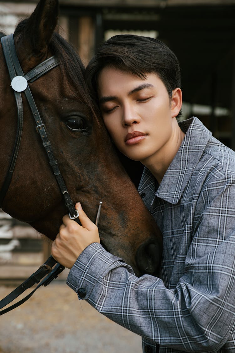 Man Hugging Horse With Eyes Closed