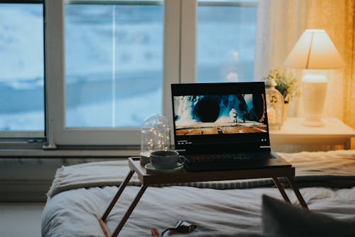 A Laptop in a Bedroom