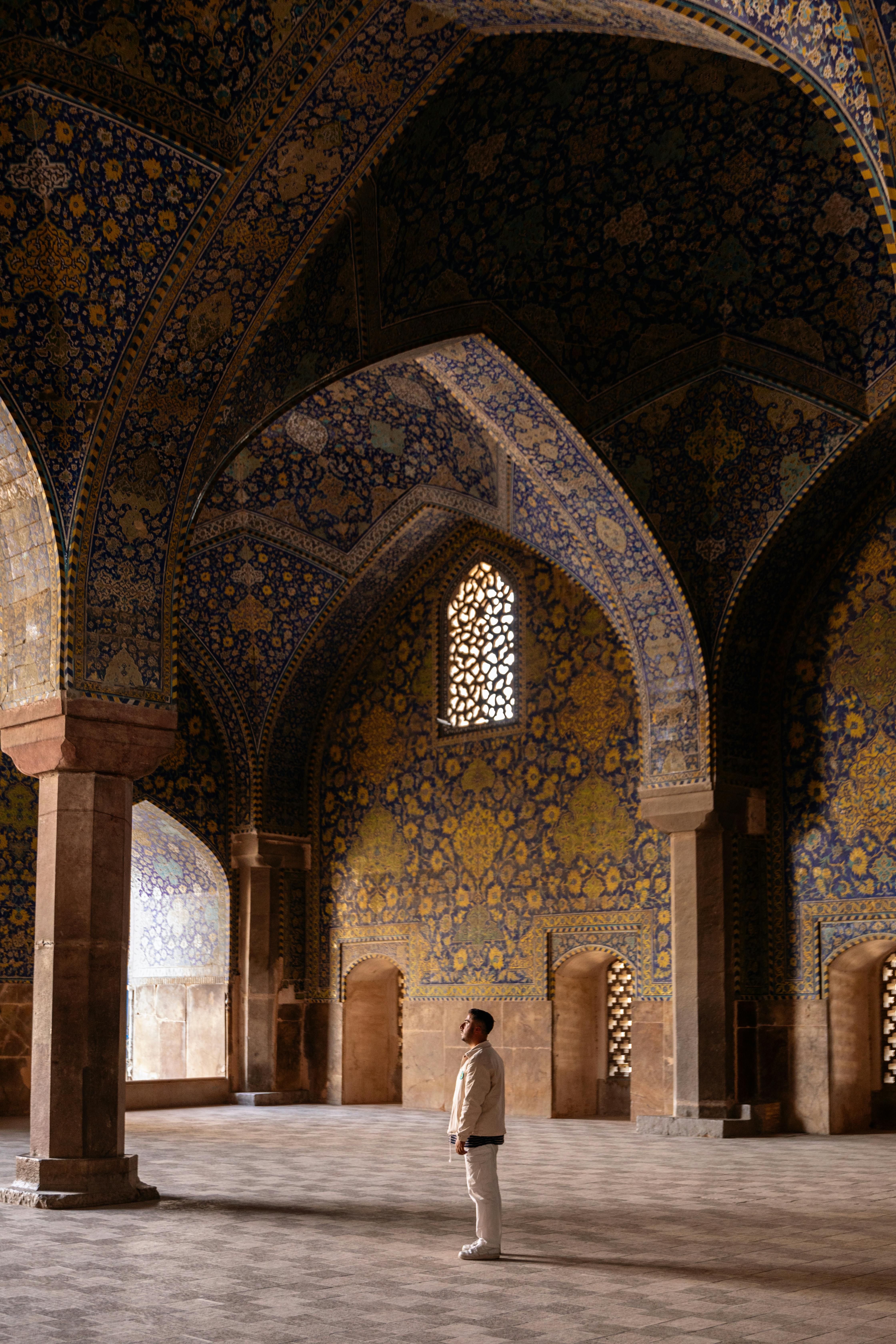 man at shah mosque in isfahan in iran