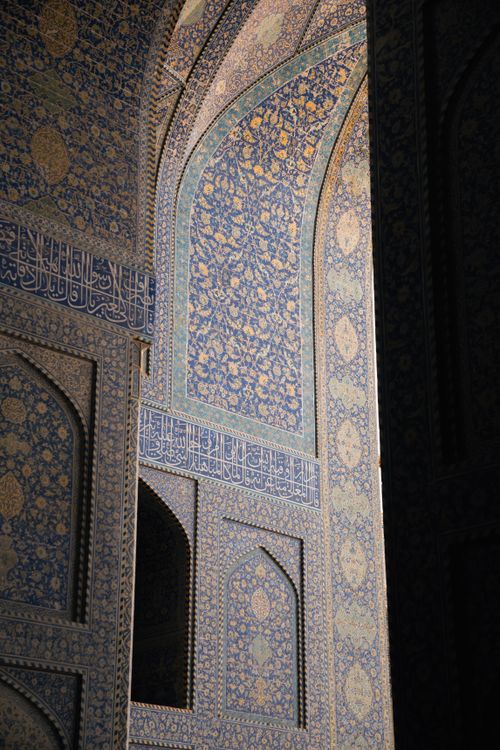 Free Stunning blue and gold mosaic details of an Islamic building interior wall, showcasing intricate patterns. Stock Photo