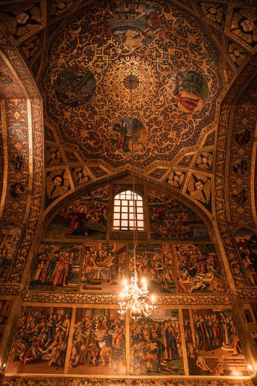 Free Detailed view of an ornate church ceiling showcasing religious art and intricate designs. Stock Photo
