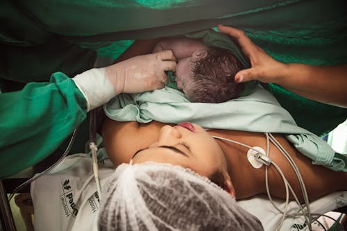 Nurse Attending to Mother with Newborn