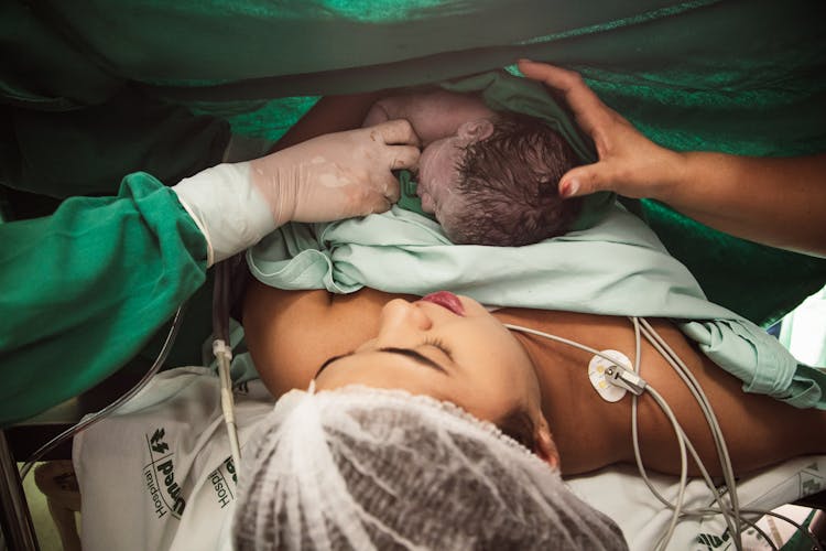 Nurse Attending To Mother With Newborn