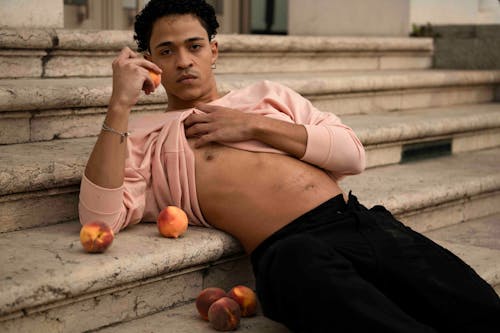 Man Posing with Peaches
