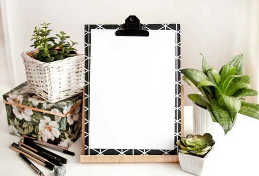 Paper On Board Beside Pens 
