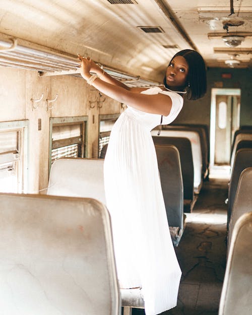 Woman in White Dress on Vintage Train