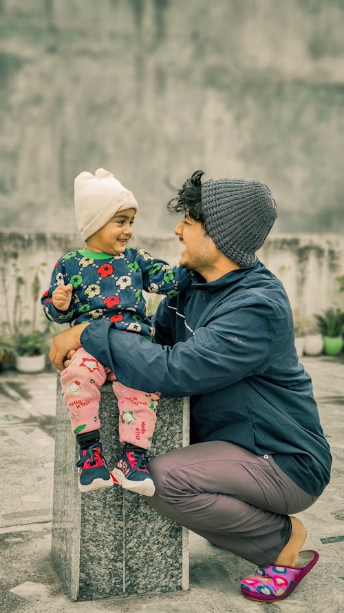 Free Father with His Small Child in the Courtyard Stock Photo