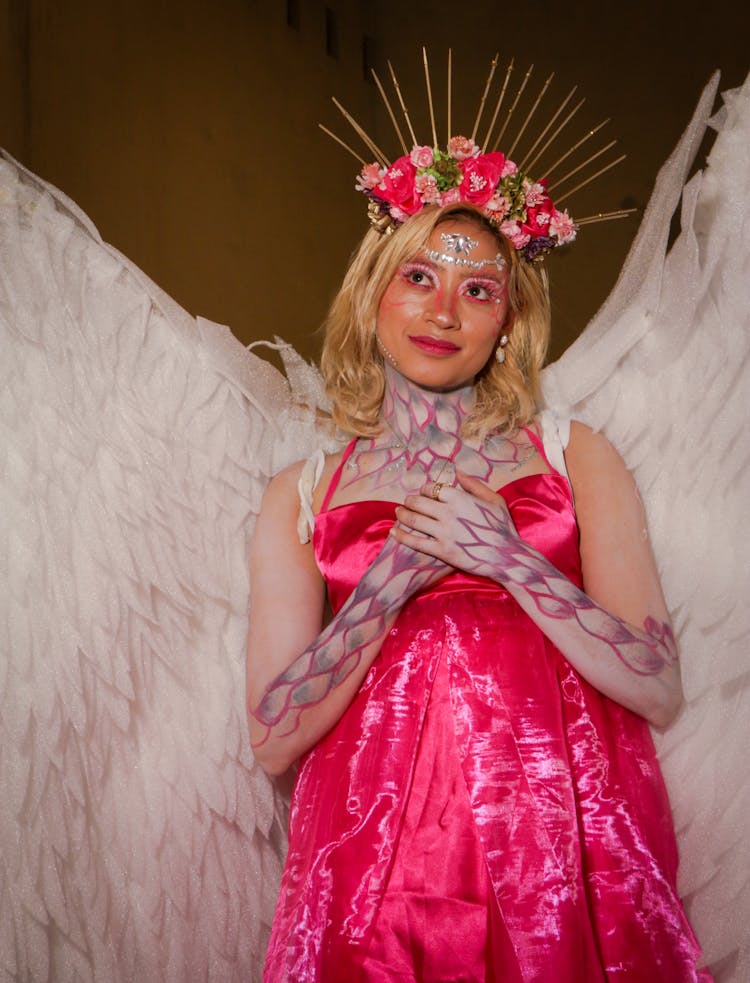 Portrait Of Smiling Woman In Angel Costume