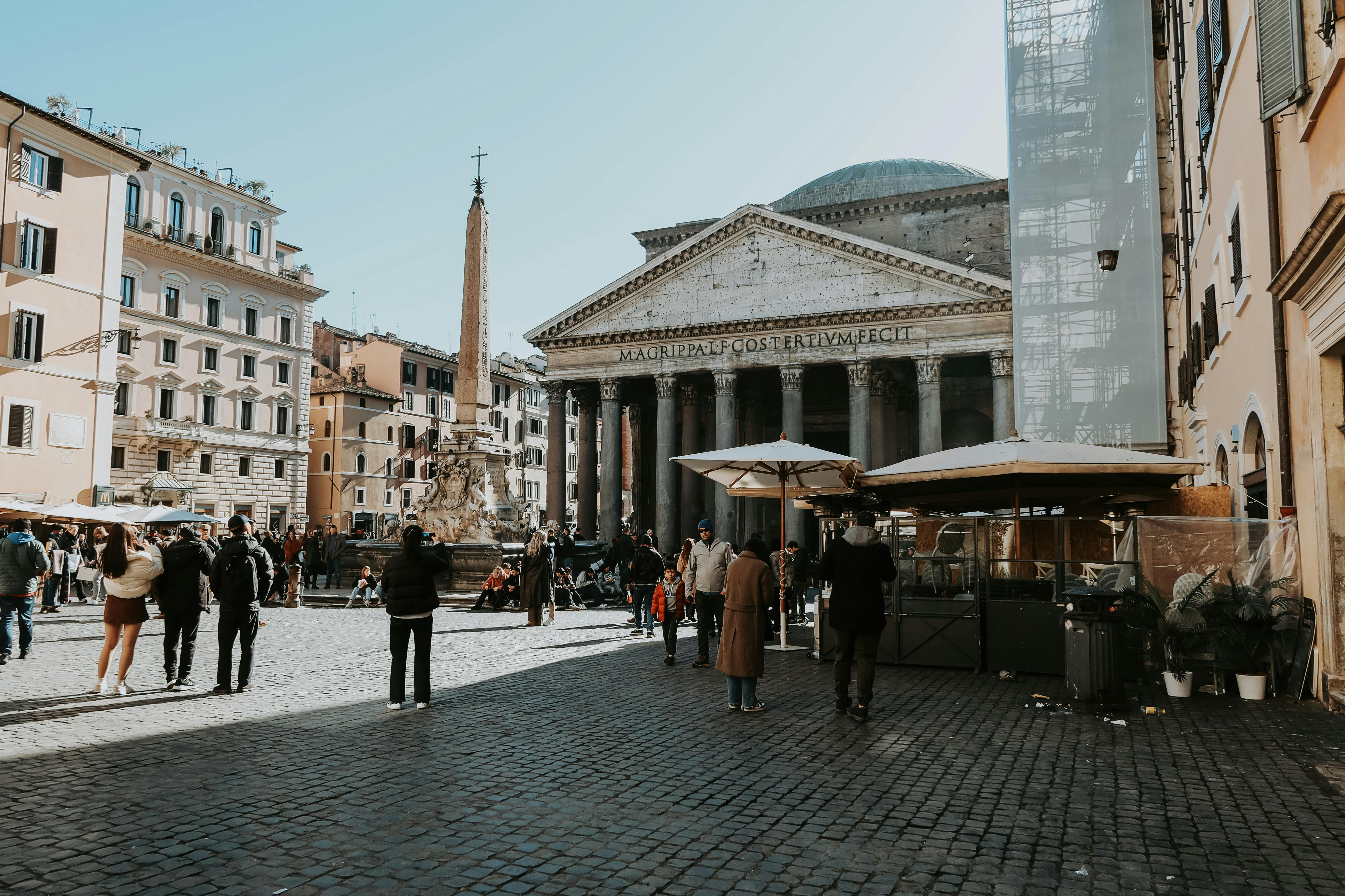 a busy piazza della rotonda square with view of the pantheon in rome italy