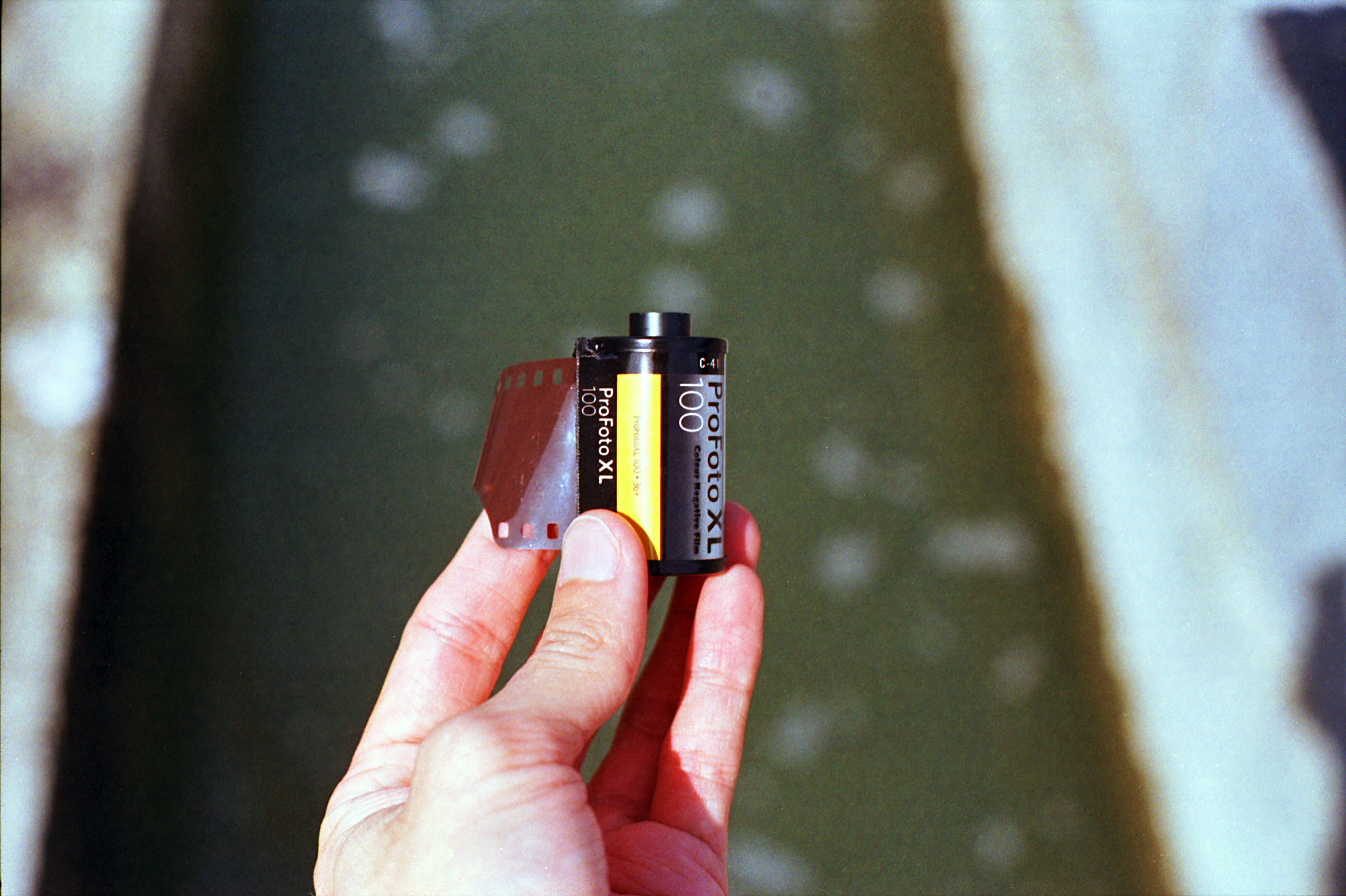 close up of a man holding a film roll