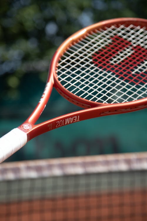 Close-up of a Tennis Racket on a Tennis Court 