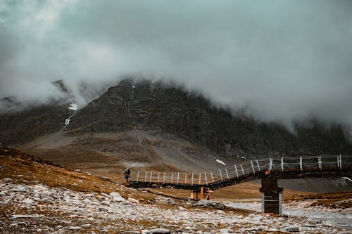 Bridge and Mountains in Clouds