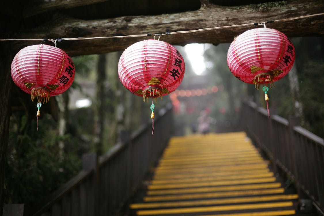 Close-up of Traditional Red Lanterns Hanging on a Line 