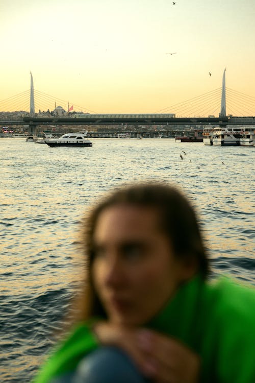 Halic Bridge behind Woman in Istanbul at Sunset