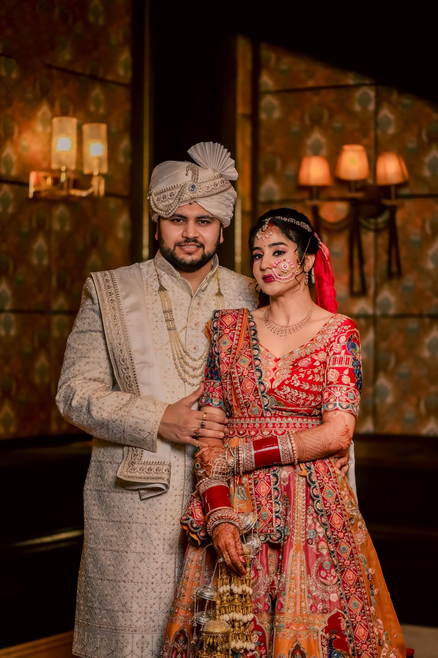 Elegant North Indian bride and groom in traditional wedding attire